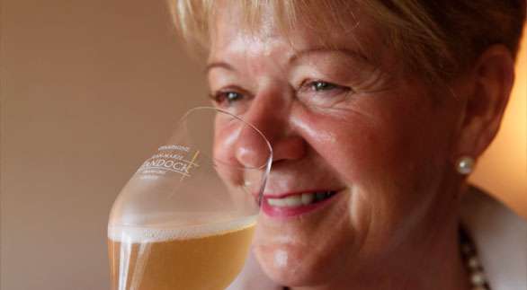 Portrait of Mrs Bandock during a tasting of Bandock Champagne
